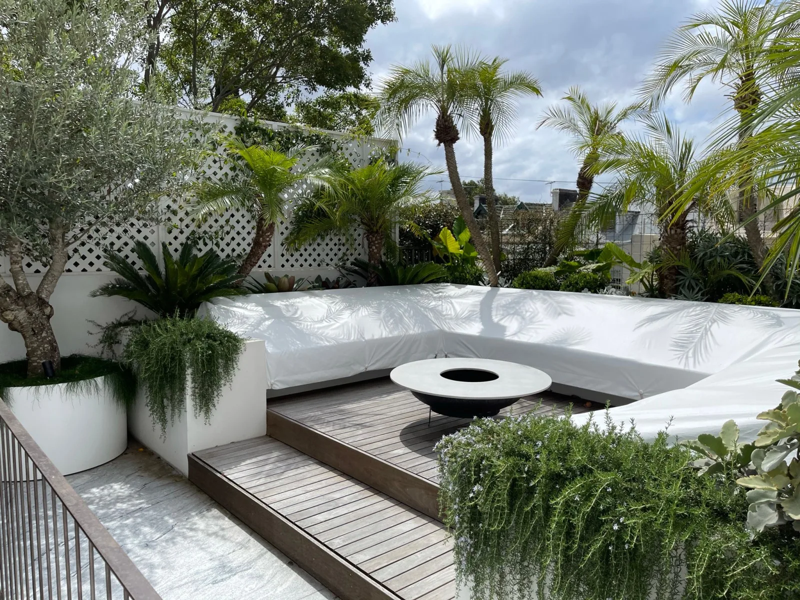 Tropical courtyard planting with layered greenery